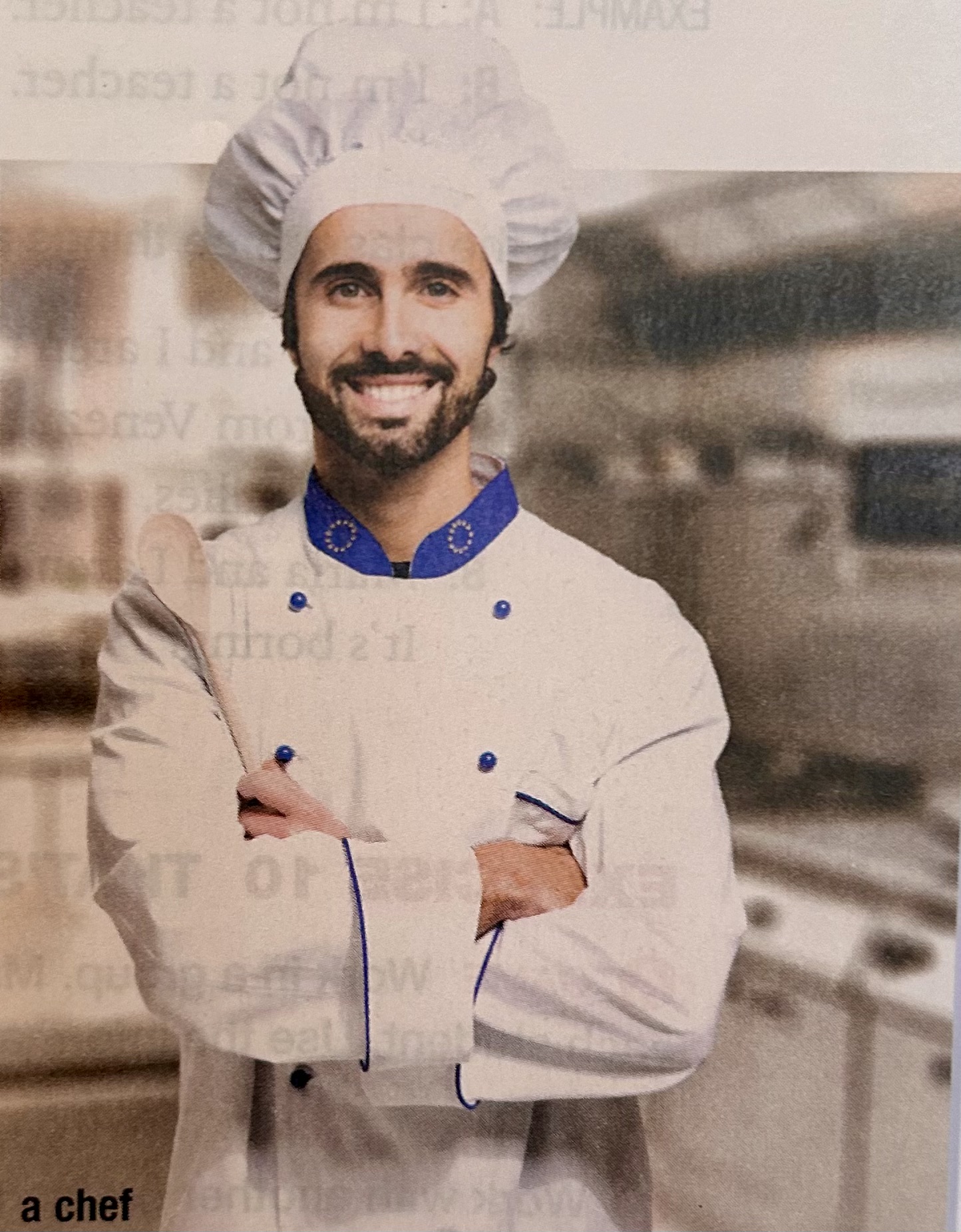 chef with arms crossed smiles